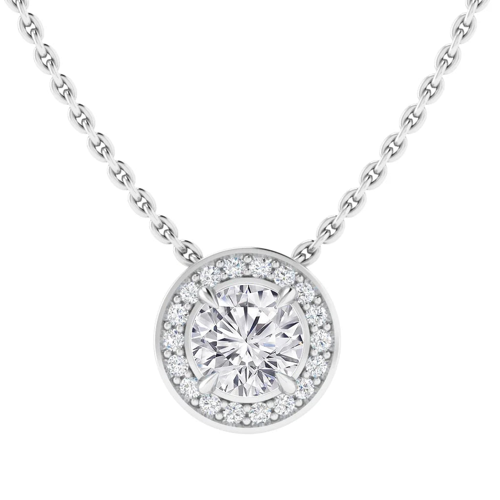 A silver necklace with a round diamond pendant surrounded by a halo of smaller diamonds.