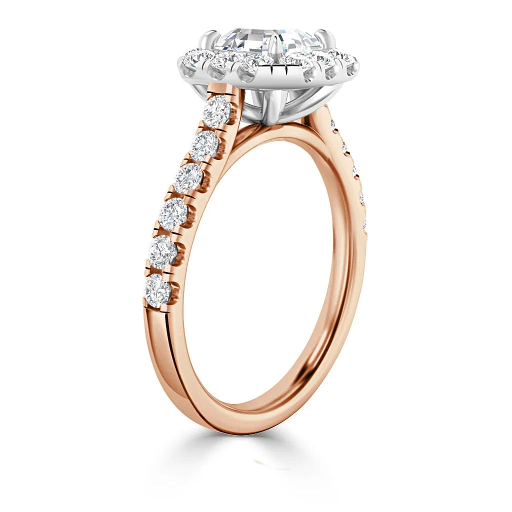 Rose gold ring with a large round diamond center and smaller diamonds along the band, shown from the side.