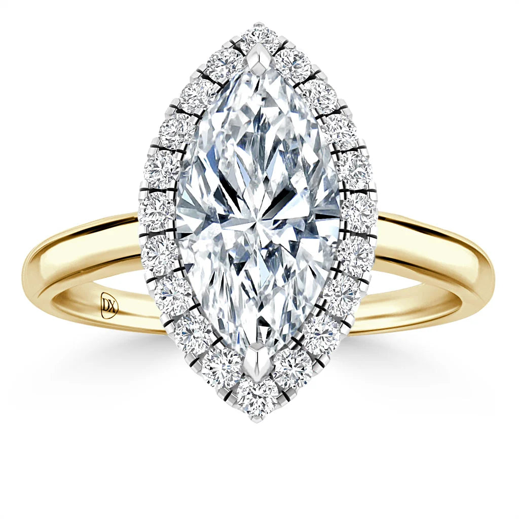 Gold ring with a marquise-cut center diamond, surrounded by a halo of smaller round diamonds.