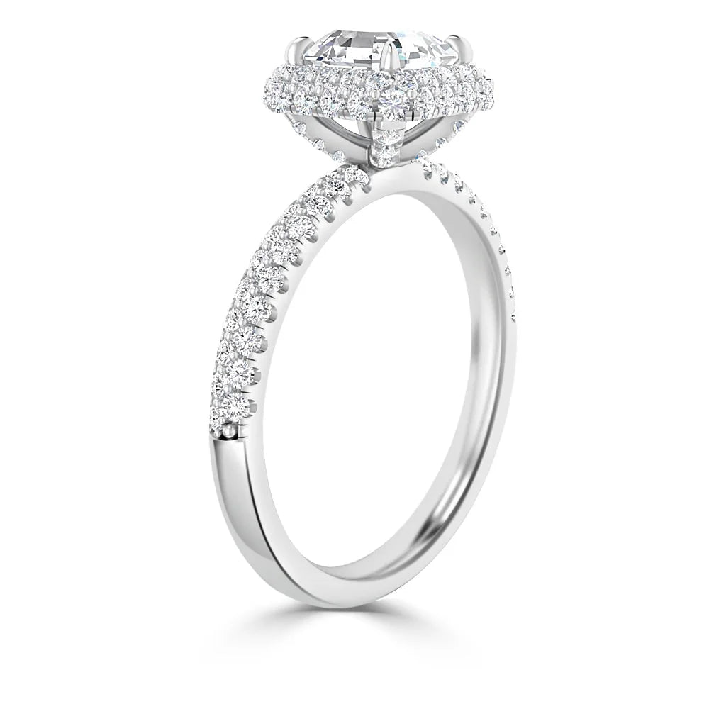 Side view of a white gold ring with a large round diamond and pavé diamonds along the band and setting.