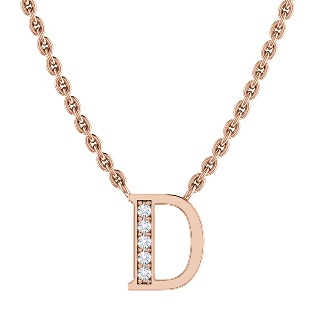Rose gold chain necklace with a D pendant; vertical row of diamonds decorates the letters left side.