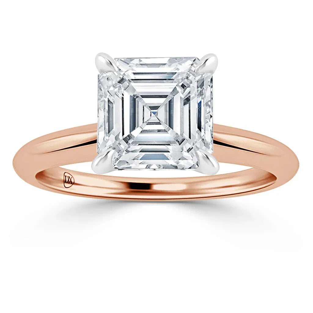 A rose gold ring with a large square-cut diamond set in a four-prong solitaire setting.