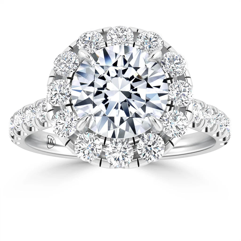 A silver ring with a large central diamond, surrounded by a halo and band of smaller round diamonds.