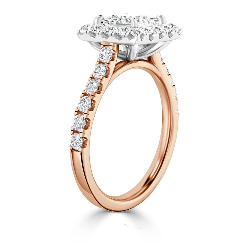 Rose gold engagement ring with round diamonds on the band and a large oval halo diamond center setting.