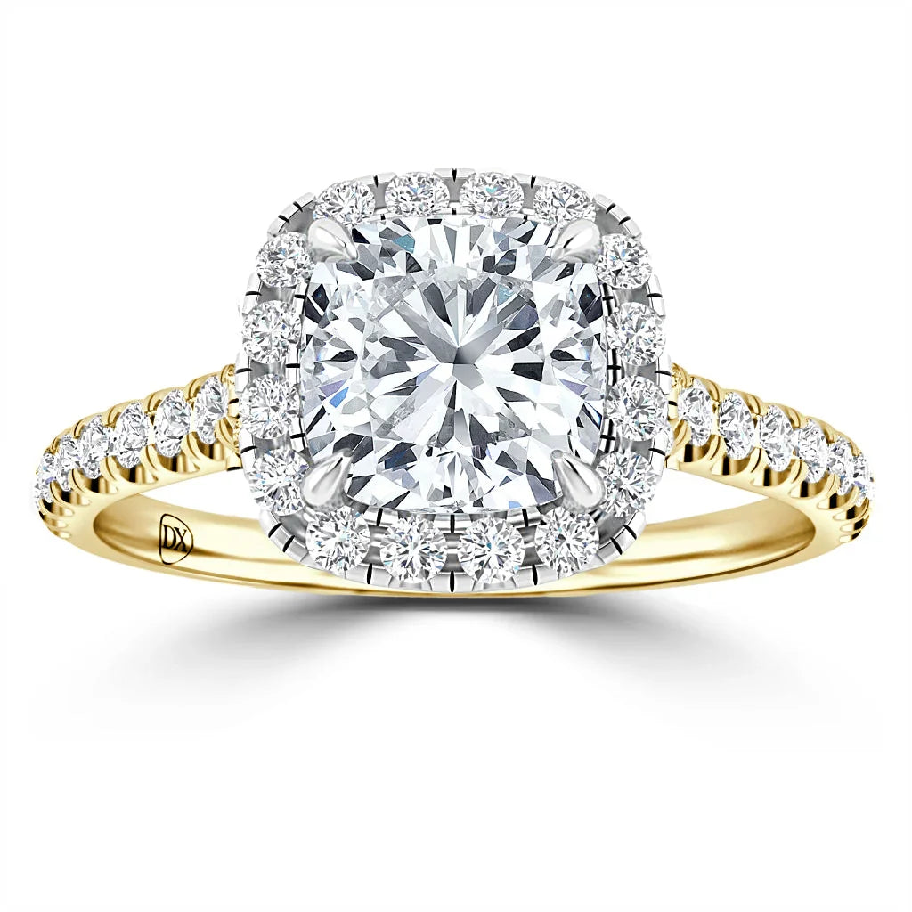 Gold ring with a cushion-cut diamond center, halo of smaller diamonds, and diamond-accented band.