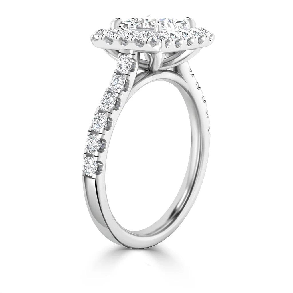 A white gold halo engagement ring with a round center diamond and diamonds along the band.