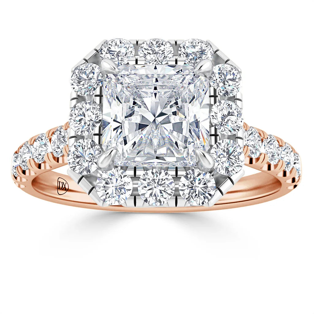 A princess-cut diamond ring with a square halo and round diamonds on a rose gold band.