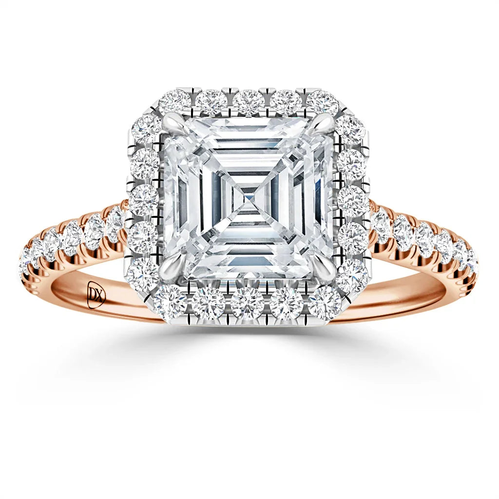 Square diamond ring with halo of smaller diamonds and rose gold band, shown on a white background.