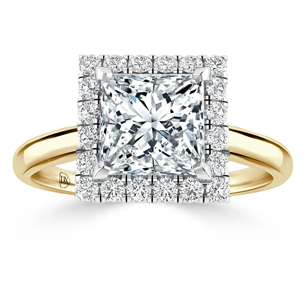 Gold ring with a large square diamond center, surrounded by two rows of small round diamonds in a halo setting.