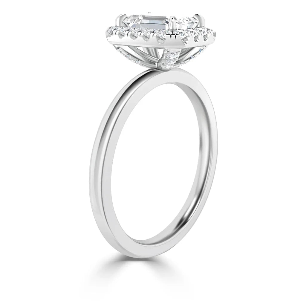 Side view of a white gold ring with a large central diamond and a halo of smaller diamonds around it.
