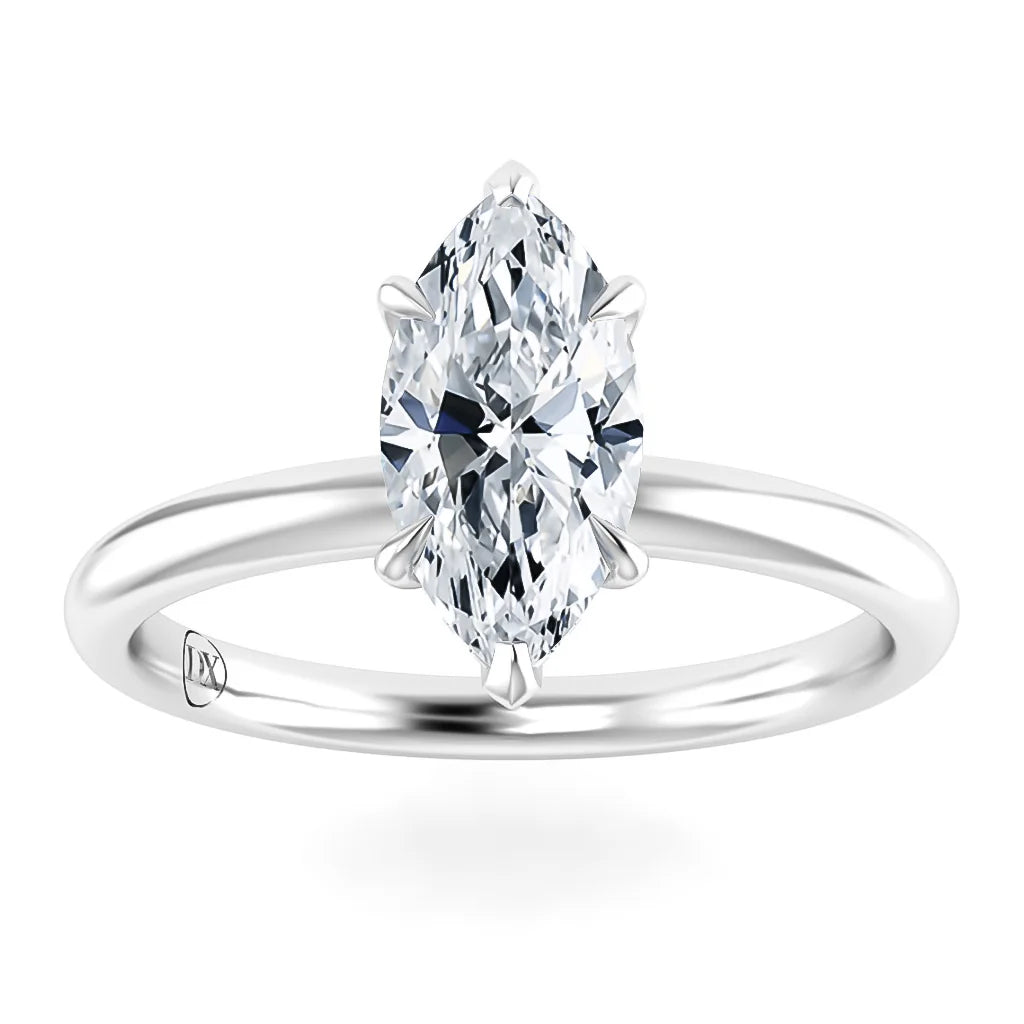 A marquise-cut diamond solitaire ring with a sleek, polished white gold band on a white background.