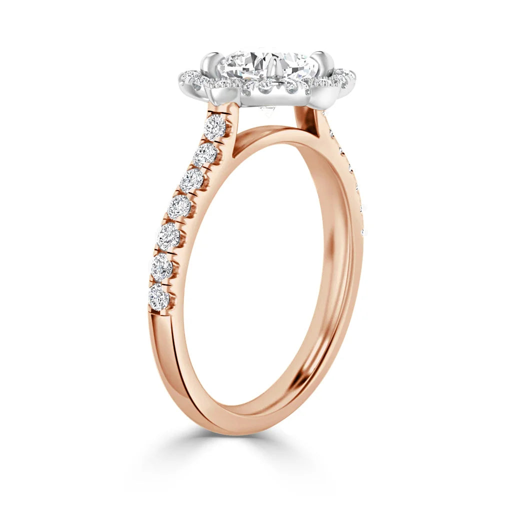 A rose gold ring with a large round diamond center, halo setting, and diamonds along the band.