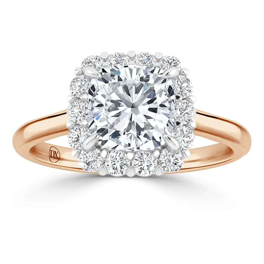 Rose gold ring with a round center diamond, surrounded by a square halo of smaller diamonds.