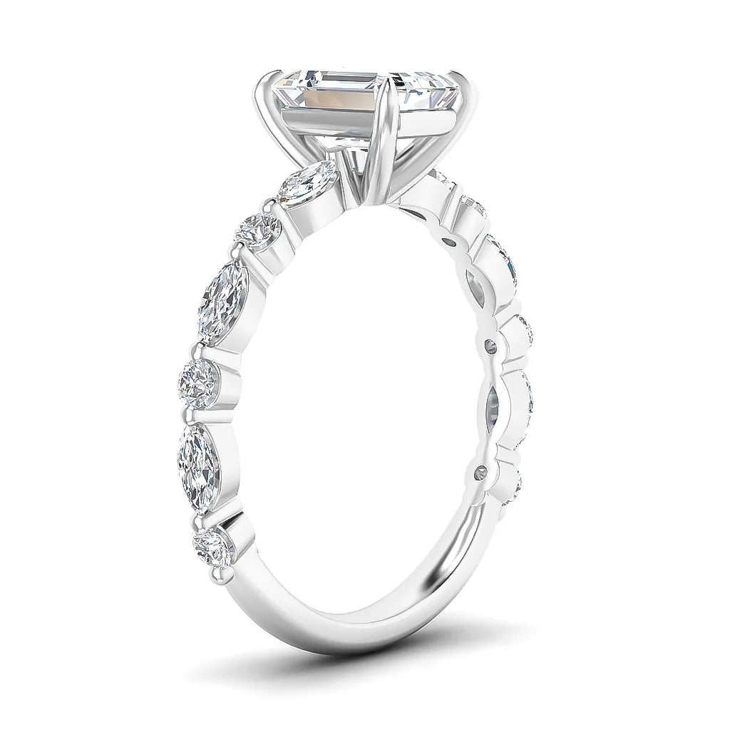 A white gold ring with marquise and round diamonds on the band and a large oval diamond in a prong setting.