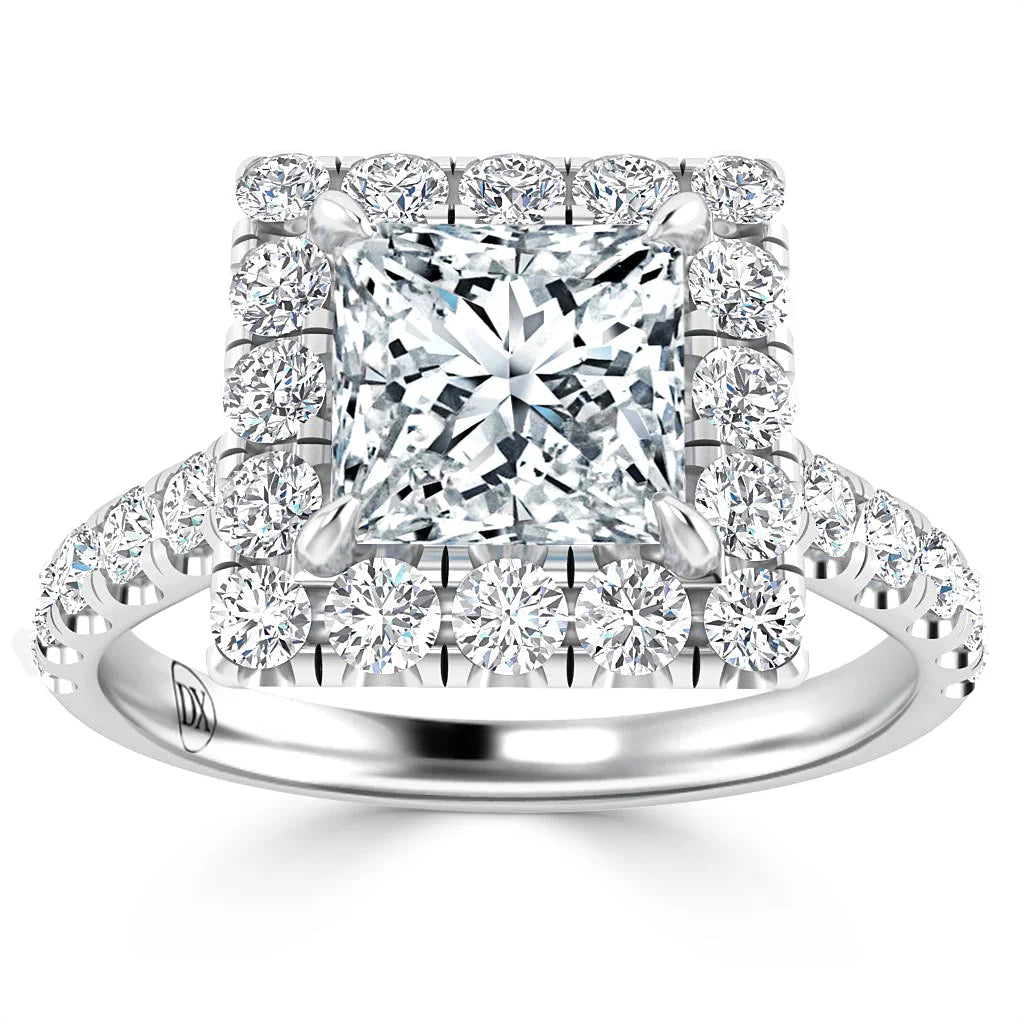 Platinum ring with a square-cut center diamond, surrounded by a double halo of round diamonds.