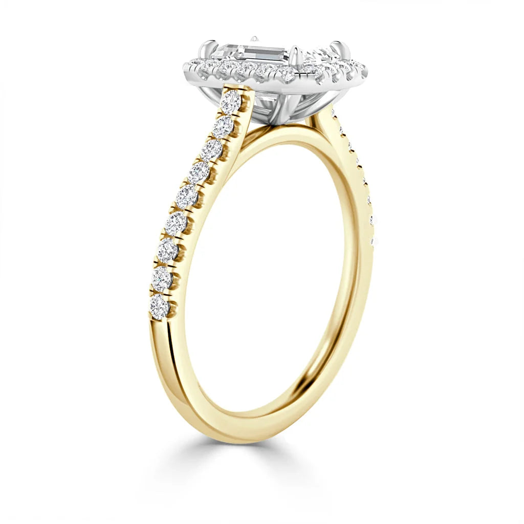 Gold ring with a diamond-encrusted band and a large rectangular center diamond in a halo setting.