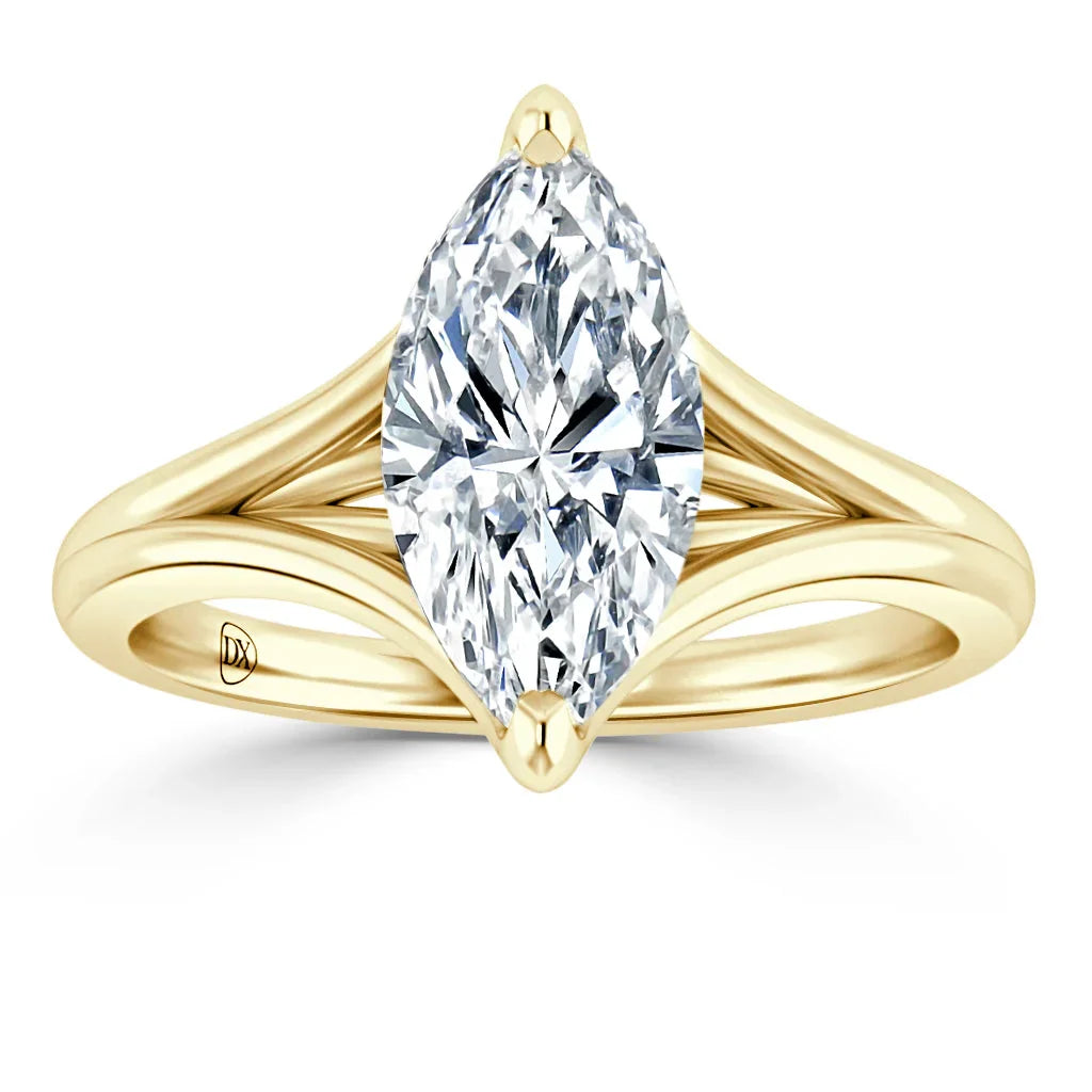A marquise-cut diamond ring with a split yellow gold band, shown on a white background.