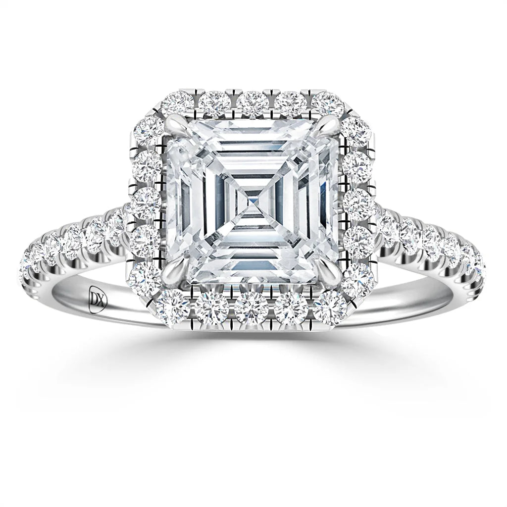 Asscher-cut diamond ring with a halo of round diamonds and a diamond-studded band on white gold.