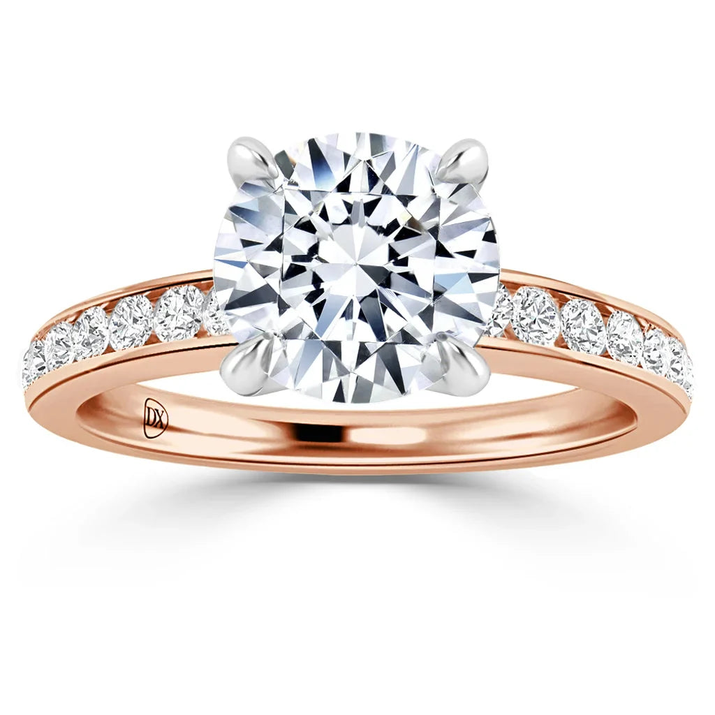 Rose gold ring with a large round diamond center stone and smaller diamonds set along the band.