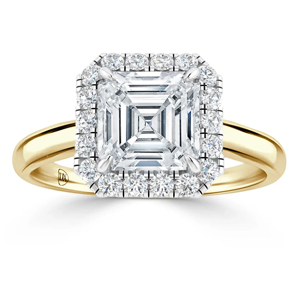 Gold band ring with a large square diamond center, surrounded by a double halo of smaller round diamonds.