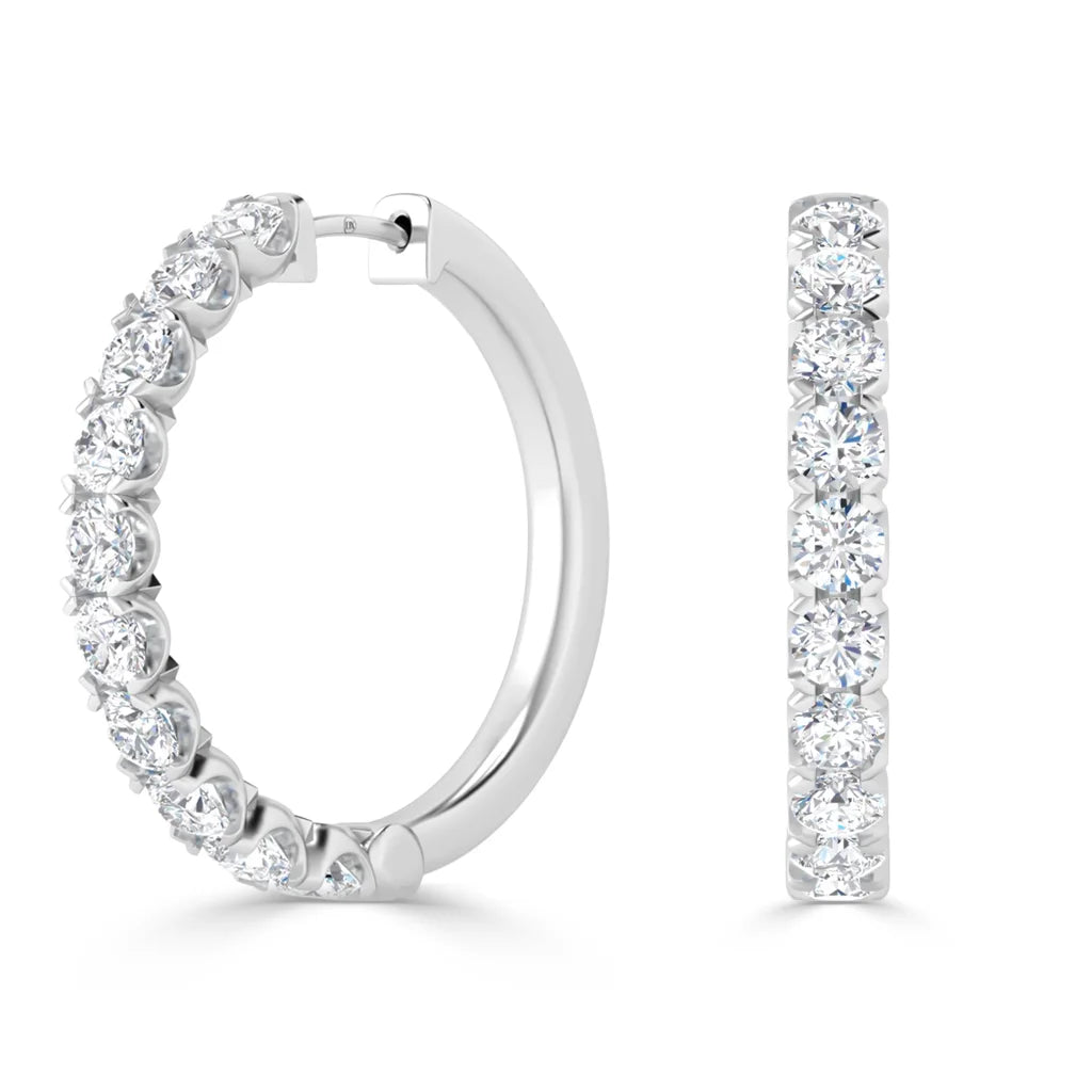White gold hoop earrings front and side views, each set with round, sparkling white diamonds.