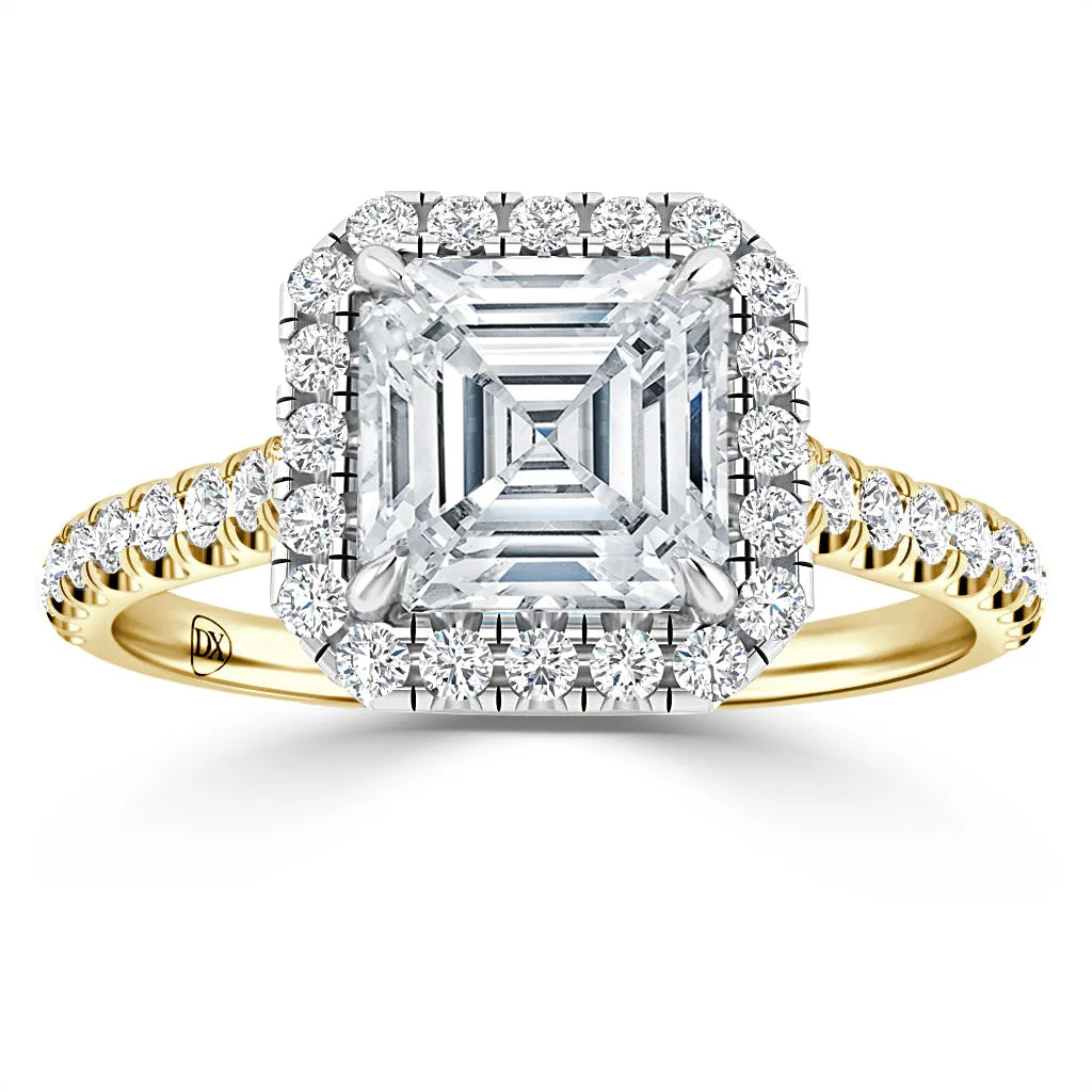 Gold ring with an Asscher-cut diamond center, diamond halo, and diamond-accented band on white background.