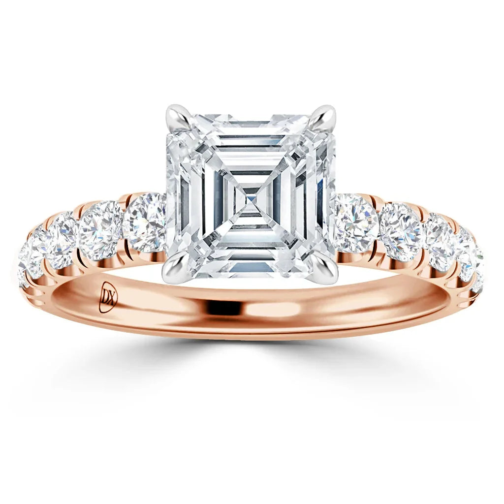 Rose gold ring with an Asscher-cut diamond center and round diamonds set along the band.