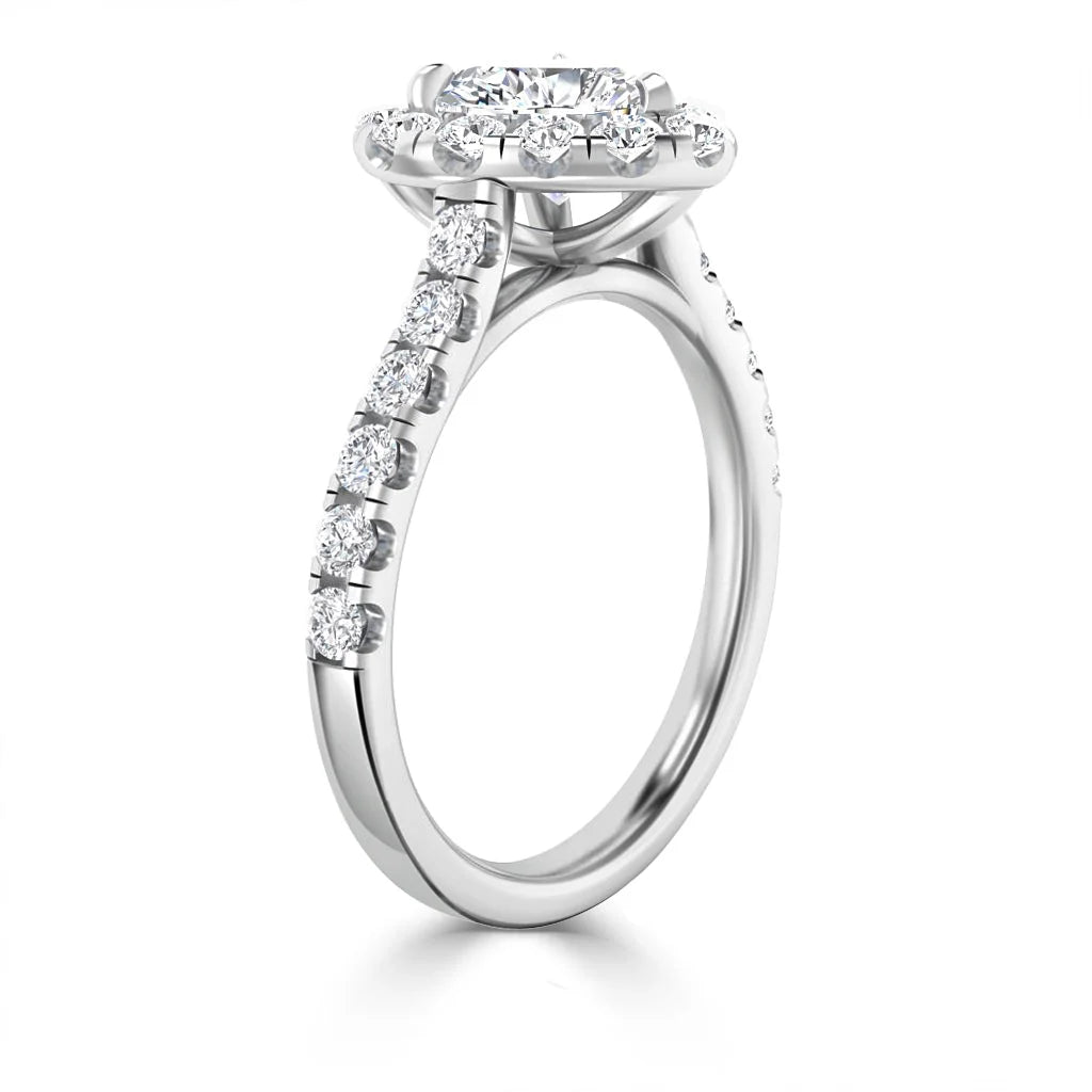 A white gold ring with a round halo diamond center and diamonds along the band.