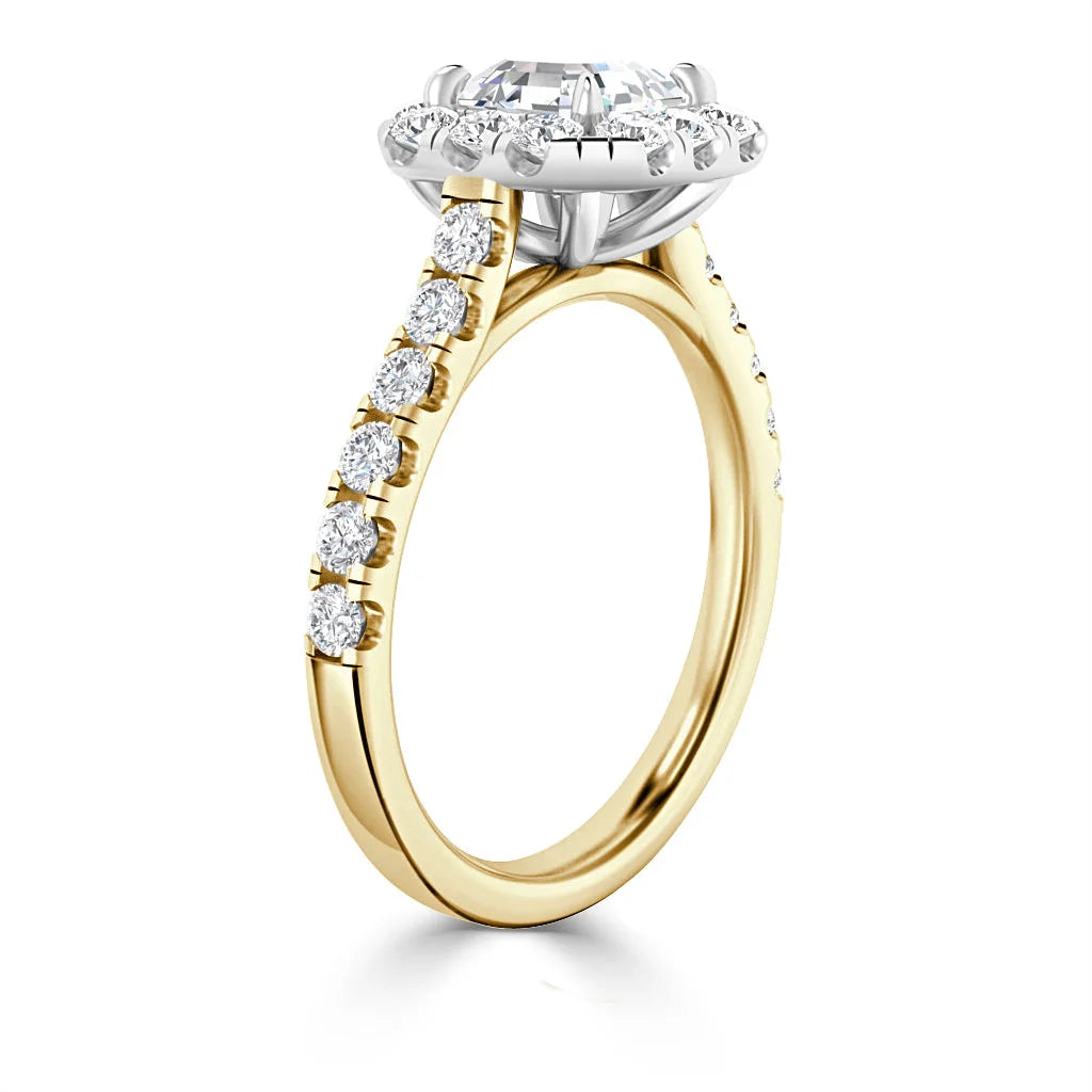 Yellow gold ring with round white diamonds on the band and a large central diamond in a prong setting.