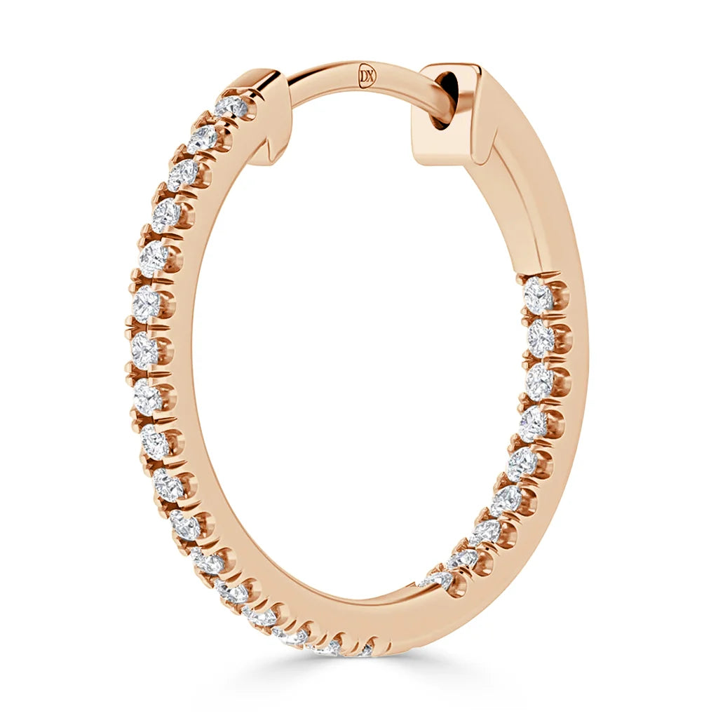 Rose gold hoop earring encrusted with small round white diamonds along the outer edge, against a white background.
