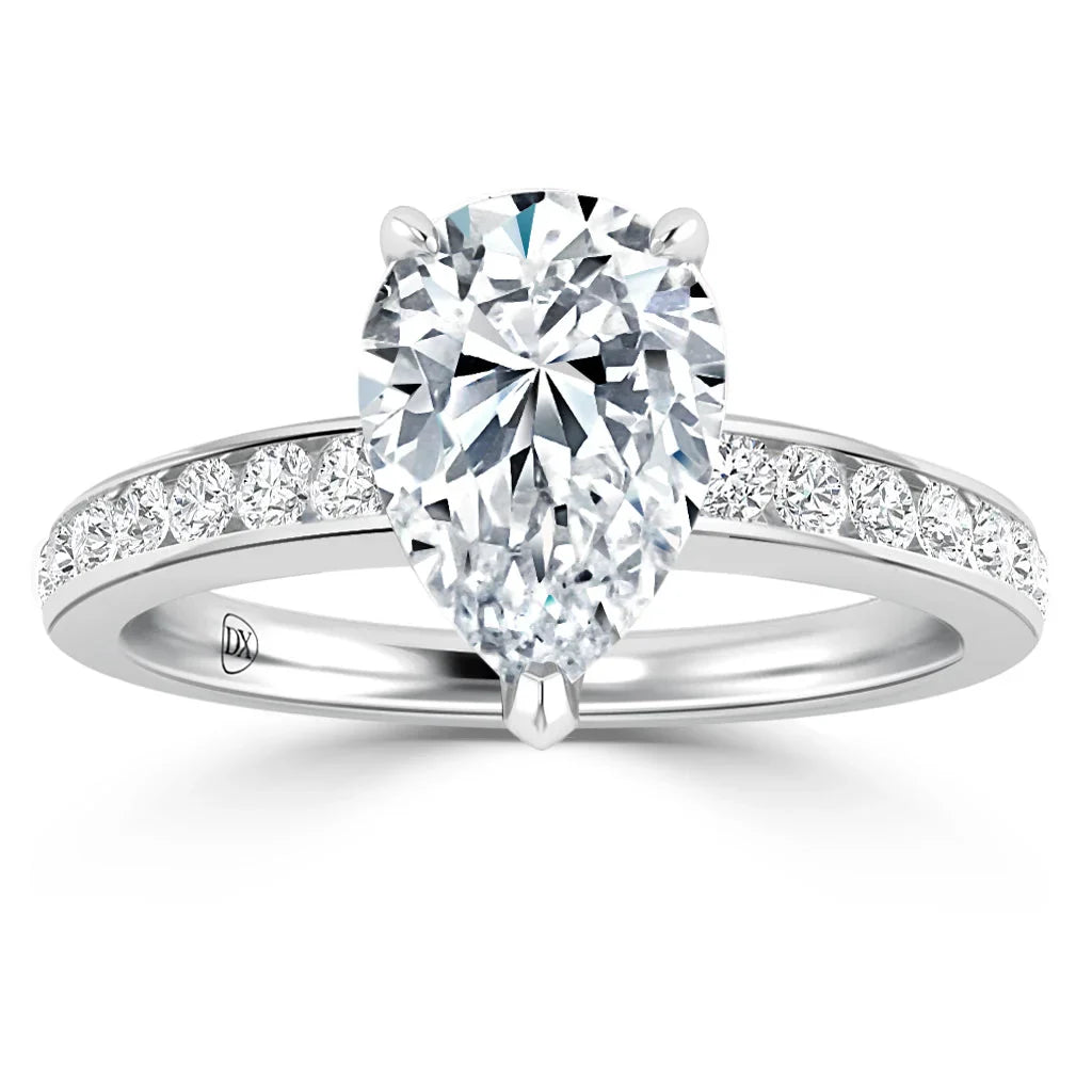 A pear-shaped diamond ring with a diamond-studded band on a white gold setting.