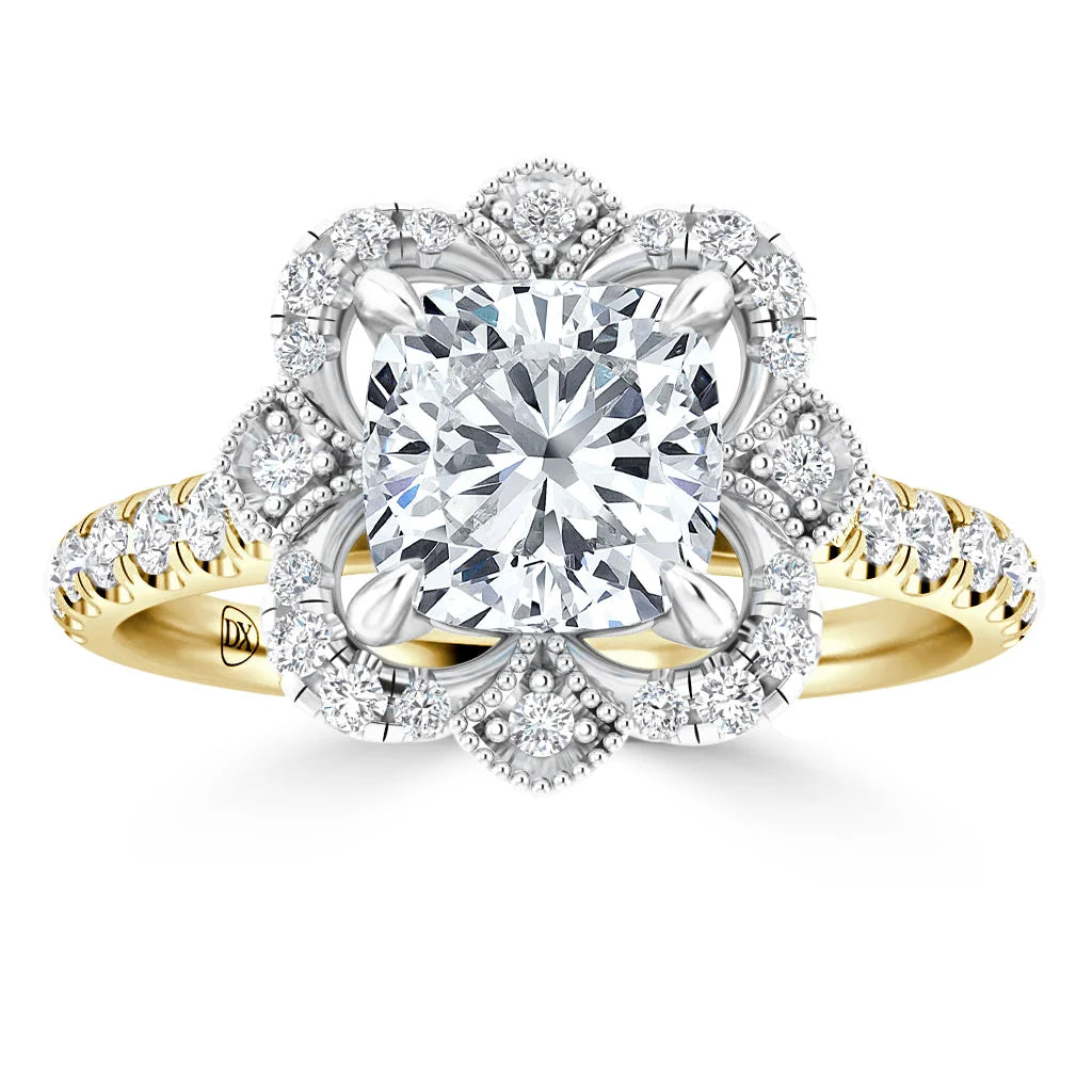Gold ring with a square diamond center, floral halo of diamonds, and diamond accents along the band.
