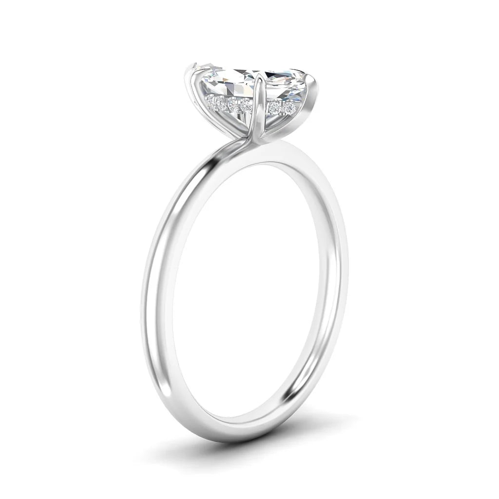 A solitaire diamond engagement ring with a round-cut diamond set on a thin, polished white gold band.