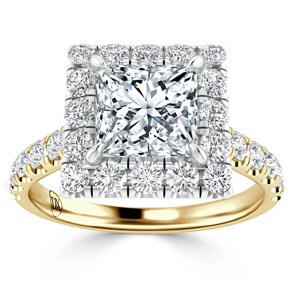 Gold ring with a square-cut center diamond, haloed by round diamonds, and diamonds on the band.