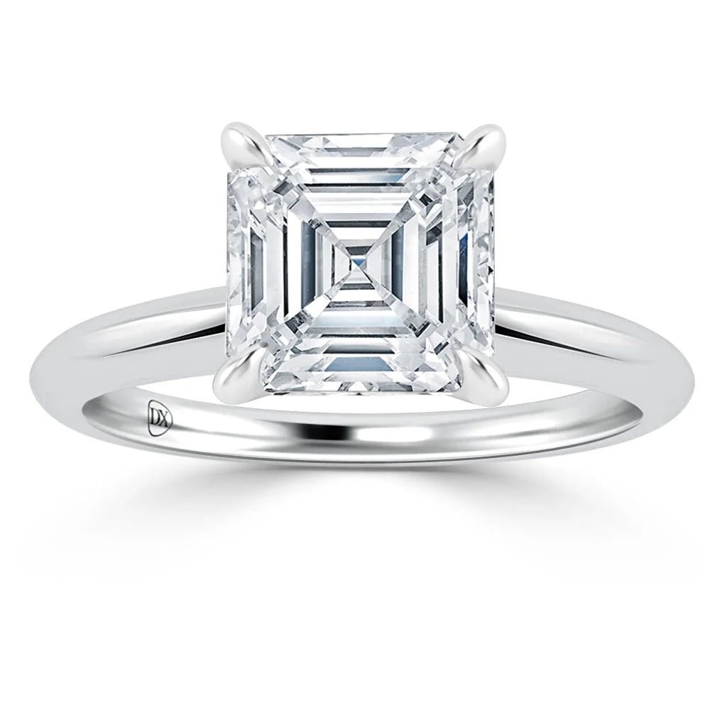 A silver ring featuring a large, square-cut diamond in a four-prong solitaire setting, shown on a white background.