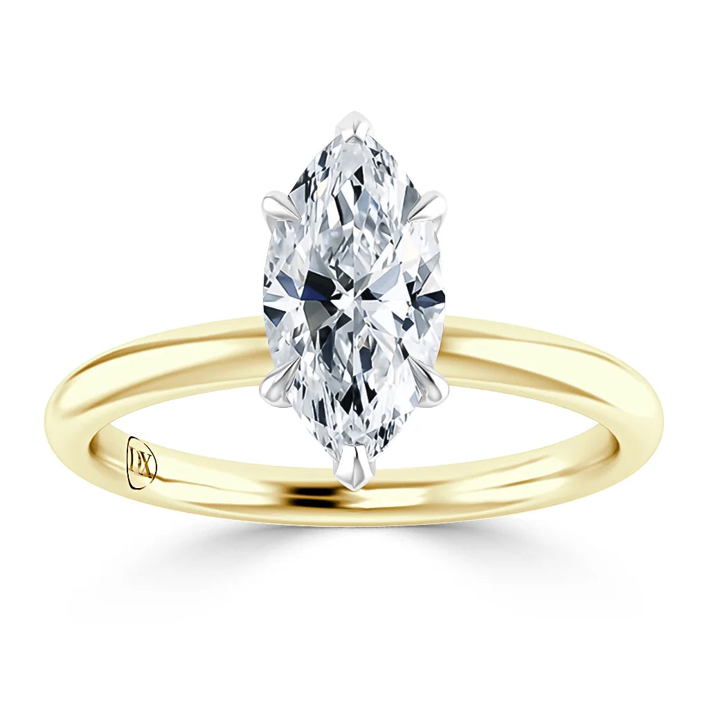 A gold band ring with a marquise-cut diamond solitaire set in six prongs, displayed on a white background.