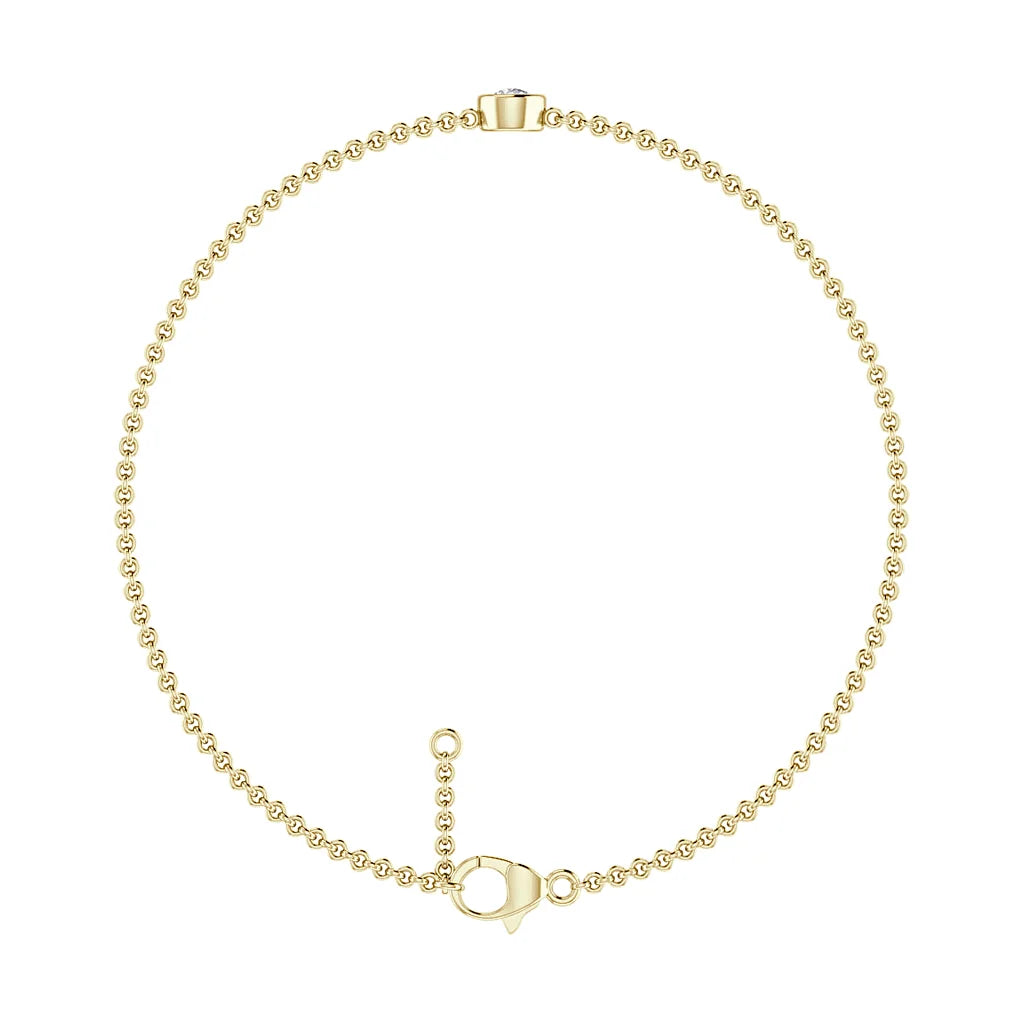 Delicate gold beaded chain bracelet with a lobster clasp and a small extender loop on a white background.