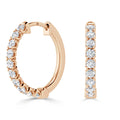 Rose gold hoop earrings with a row of round, white diamonds set along the outer edge.