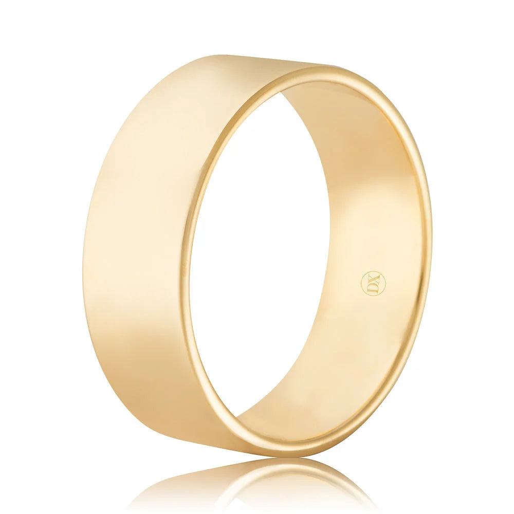 Plain gold wedding band with a smooth, polished finish, shown on a white background with a small stamp inside.