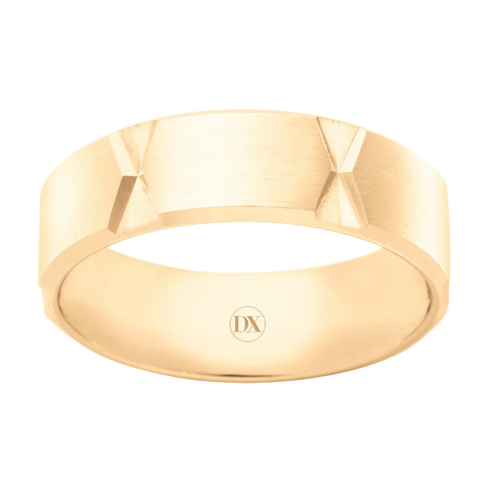 Matte gold band ring featuring two pyramid-shaped studs and an engraved DX on the inner surface.