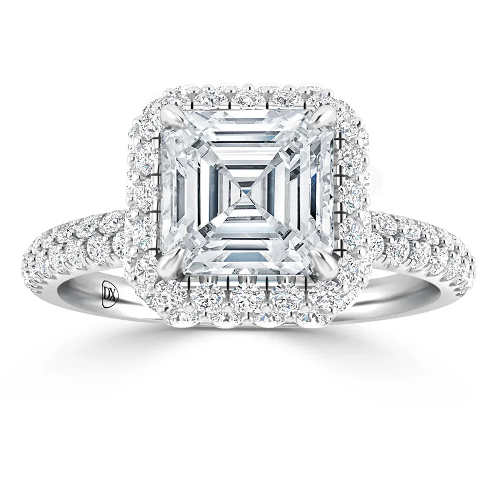 Asscher-cut diamond ring with a halo of smaller diamonds on a pavé diamond band, in white gold or platinum.