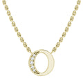 Gold chain necklace with a circular pendant featuring a crescent of small sparkling diamonds.