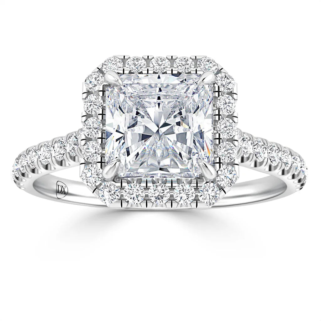 Square-cut diamond ring with a halo of smaller diamonds and a diamond-studded band, set in white gold.