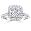 Square-cut diamond ring with a halo of smaller diamonds and a diamond-studded band, set in white gold.