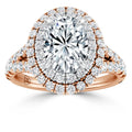 Rose gold ring with large oval diamond center, double halo, and diamond accents on split band, all sparkling.