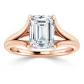 Emerald-cut diamond ring with a split rose gold band, shown on a white background.