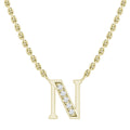 Gold chain necklace with a pendant shaped like the letter N, adorned with small sparkling diamonds.