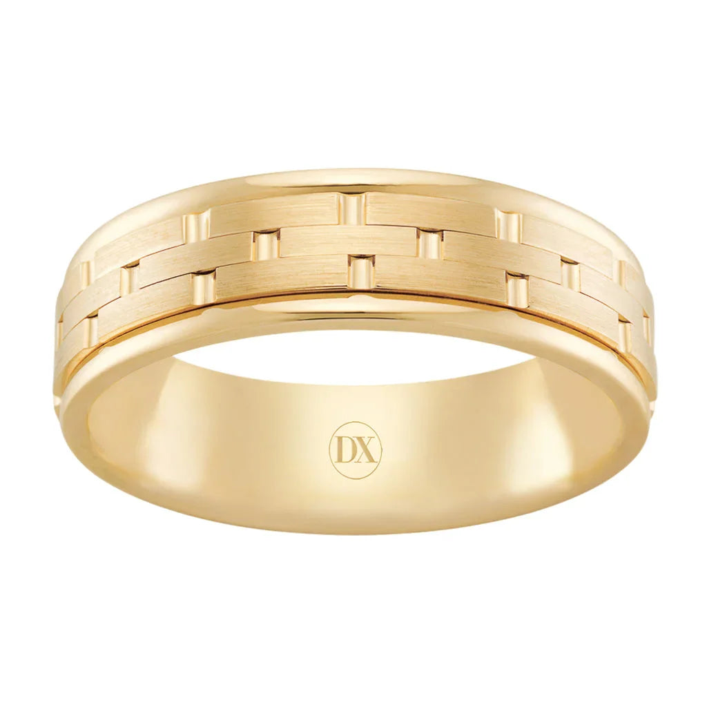 A gold ring with a brushed finish and a geometric brick-like pattern around the band.