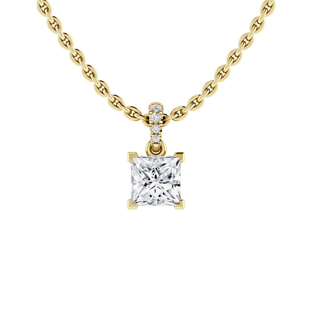 Gold chain necklace with a square diamond pendant and small diamonds above the pendant against a white background.