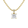 Gold chain necklace with a square diamond pendant and small diamonds above the pendant against a white background.